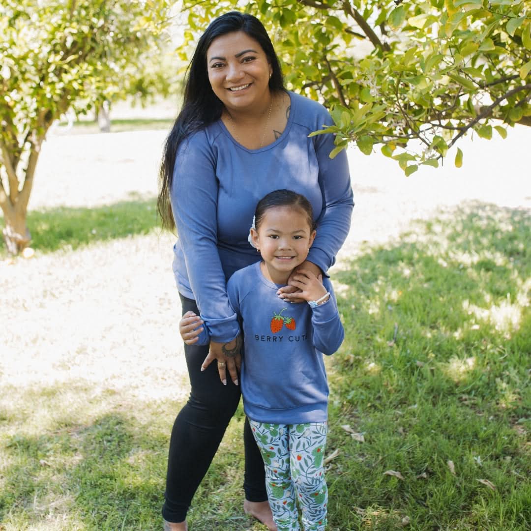Mother and daughter in matching blue tops wearing Ladies Bamboo Raglan Pullover