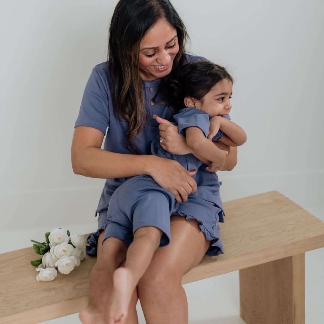 Mother and child in matching blue bamboo baby clothes Canada lounge sets