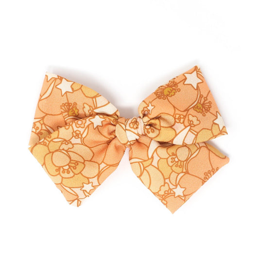 Why Every Fashionista Needs a Star Flowers | Midi Bow in Their Collection