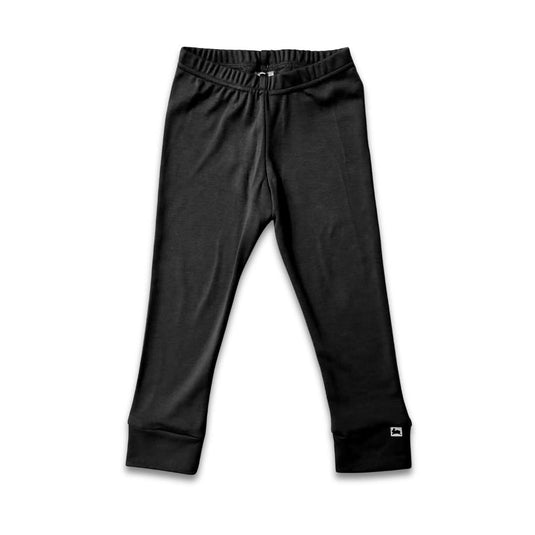 Little & Lively Kids Bamboo Leggings in black, ankle-length with an elastic waistband and cuffed ankles, are shown laid flat on a white background. A small white logo tag is visible near the bottom of one leg.