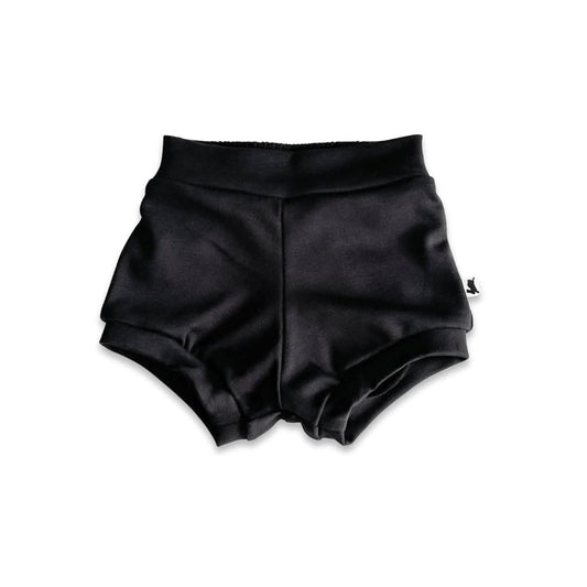 The Little & Lively Baby Bamboo High-Waisted Shorties are soft, stretchy black shorts for babies or toddlers, shown flat on a white background—ideal for any baby wardrobe.