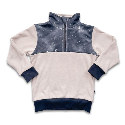The Little & Lively Youth Bamboo Fleece Half-Zip in Ash with Night Sky is an ethically made, cozy pullover featuring a star and constellation pattern with matching navy cuffs and waistband.