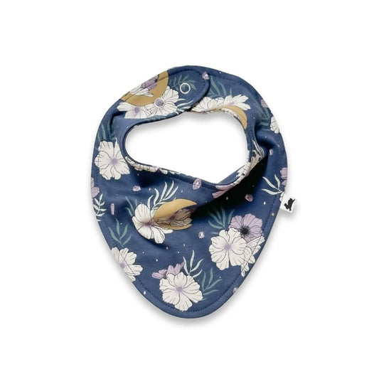 The Little & Lively Baby Bamboo Bib in green features a woodland pattern with white rabbits, mushrooms, leaves, and plants. Made from soft bamboo fabric, it has a triangular shape and adjustable snaps for easy fastening.