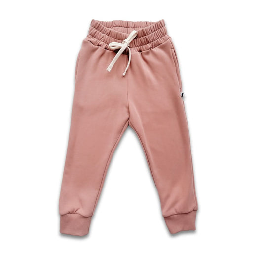 Terracotta Kids Bamboo Fleece Joggers by Little & Lively feature an elastic waistband, white drawstring, side pockets, and ribbed cuffs. These cozy joggers are laid flat on a white background for a stylish, comfortable look.