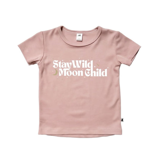 The Little & Lively Baby/Kids Bamboo Graphic T-shirt is a light pink, breathable short-sleeve shirt for youth with "Stay Wild Moon Child" in white plus moon and stars, made from a soft bamboo cotton blend, shown on a plain white background.